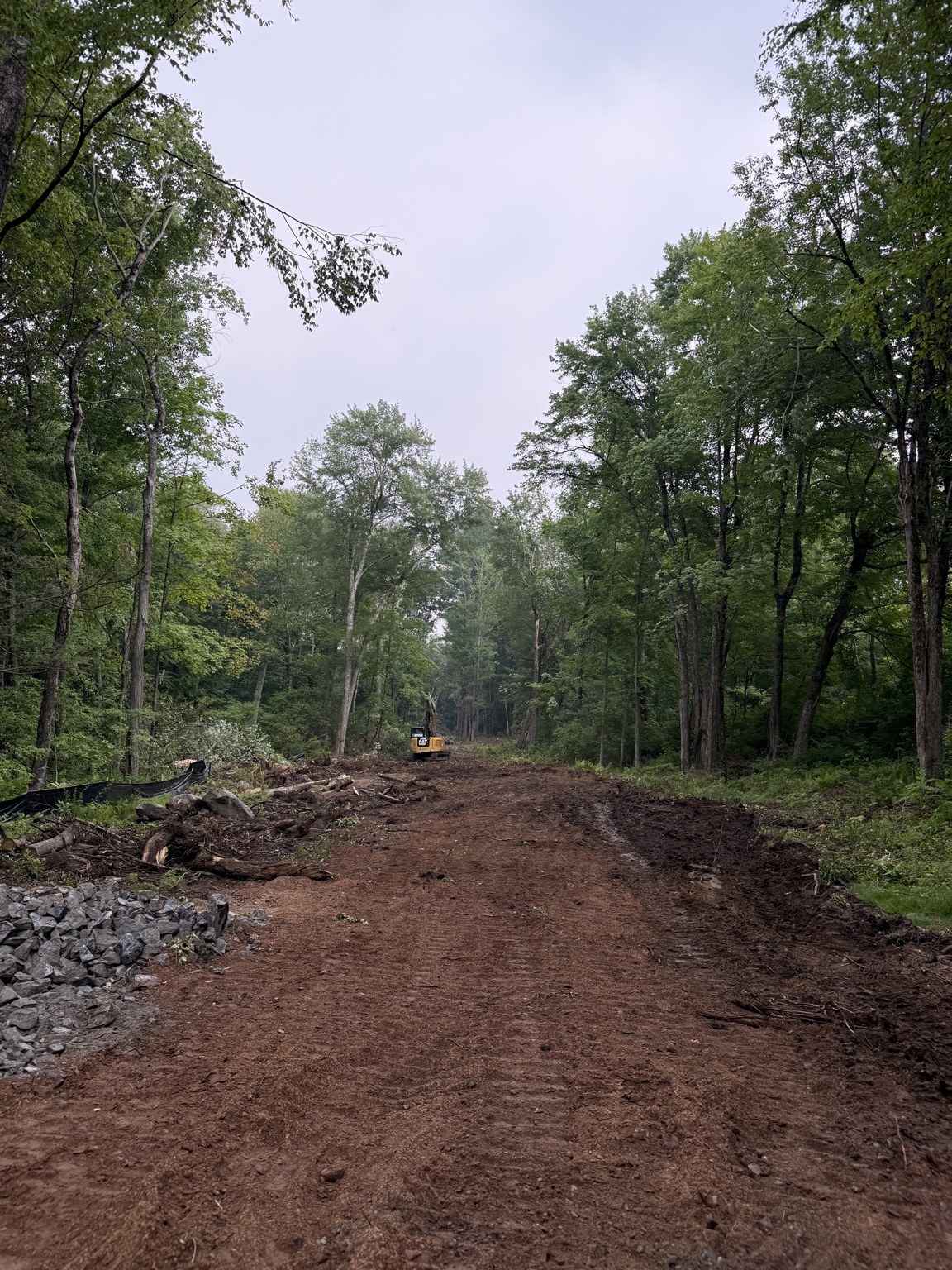 Driveway being extended toward the house site